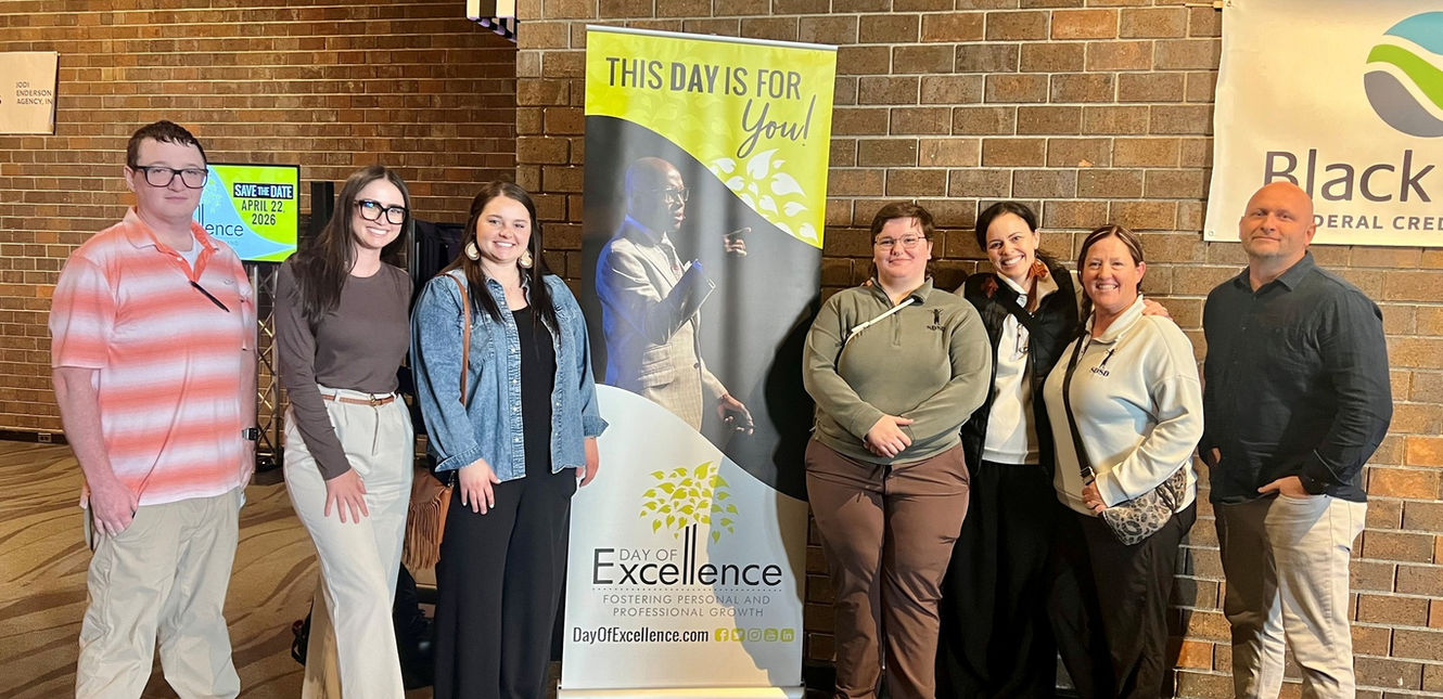 SDSD staff posing for a group photo at the Day of Excellence training